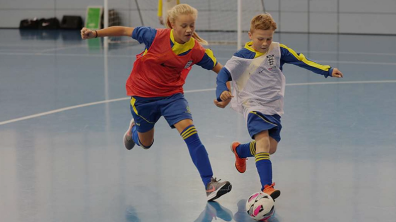Children playing futsal